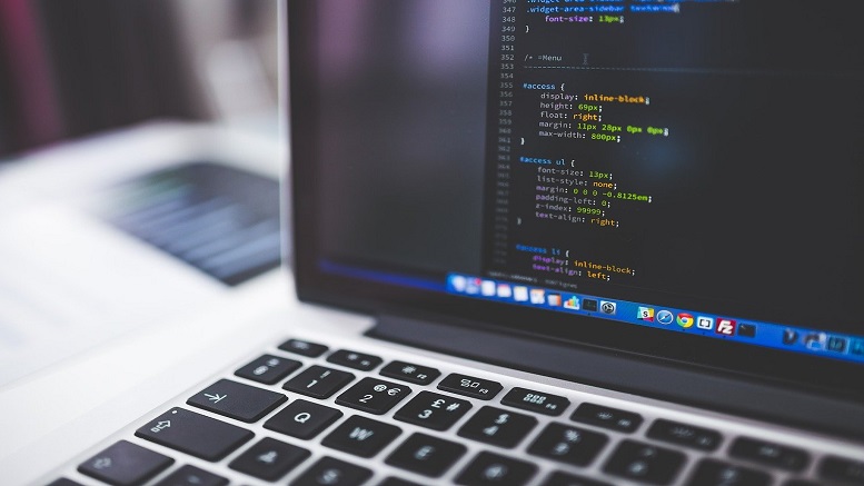 Laptop showing coding for behind the scenes of the Qmee app
